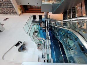 Inside Dubai's library. The image shows a Bibliotheca product,flexAMH and bulkSeparator, which streamlines returns in the library system by allowing users to drop off items through an induction point. The system then separates, checks in, sets security, and sorts all the items ready to be moved to their destination. The transportation system ensures the easy transportation of materials to the correct location across multiple floors.​