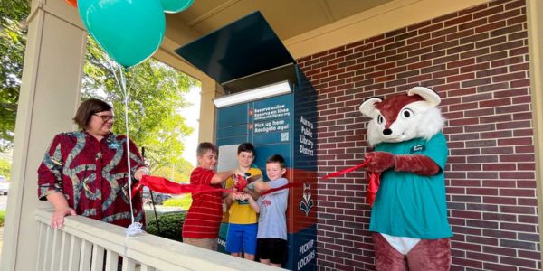 A ribbon-cutting ceremony at Aurora Public Library District, US, celebrating the launch of a remoteLocker™ for convenient self-service access.
