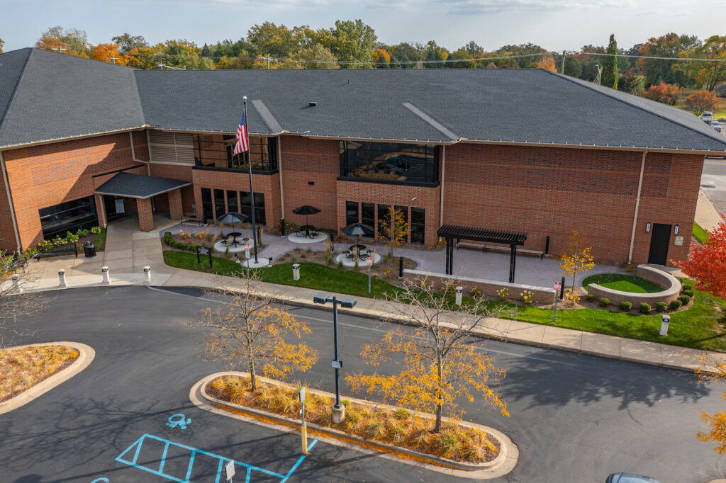 Aerial view of Redford Township District Library and surrounding area with fall foliage.