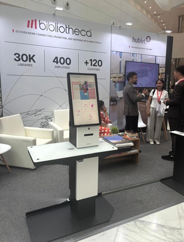 The Bibliotheca selfCheck 3000 self-service kiosk at the IFLA 2025 event, designed for easy patron use.