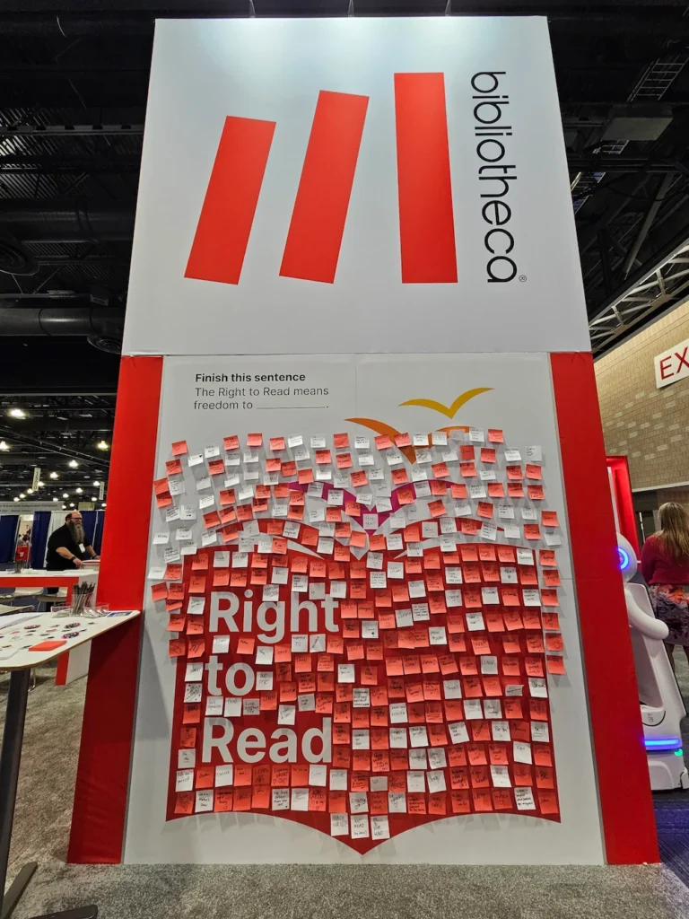 Interactive Right to Read wall at Bibliotheca’s ALA 2025 booth filled with handwritten Post-its