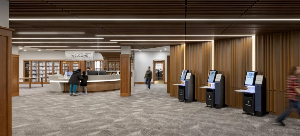 Self-checkout area and welcome desk at Redford Township District Library.