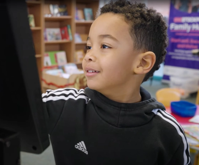 Young patron using selfCheck 2500 in children’s section